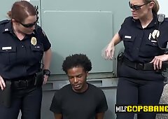 Interracial sex on the rooftop with these two horny MILFs.